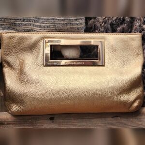 Michael Kors gold hand clutch purse. hand bag.